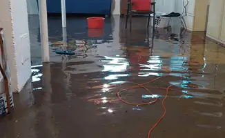Basement with boiler, cabinets and washing machine completely flooded in Fort Lauderdale, FL